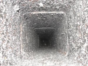view down flue of chimney that is dirty
